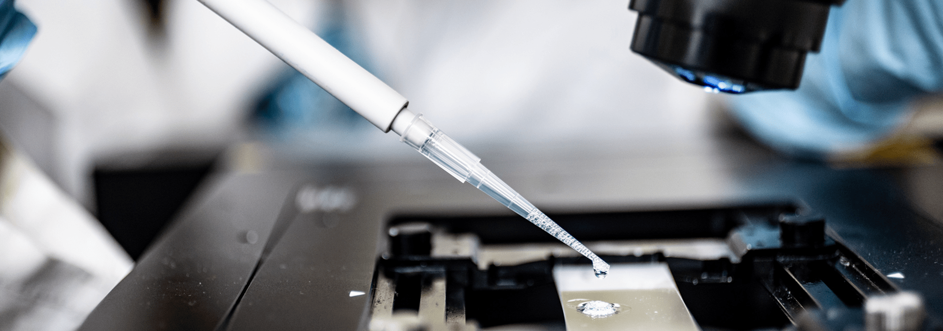 A Tulane researcher uses a microscope