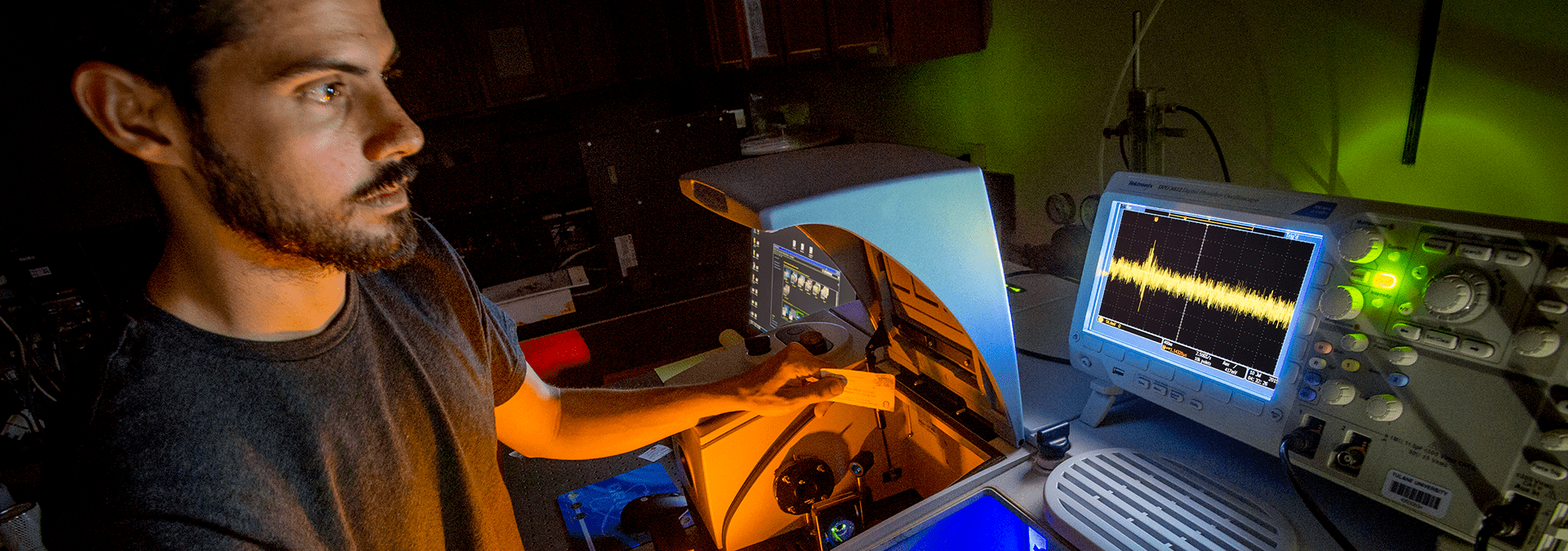 A Tulane student tunes an infrared spectrophotometer